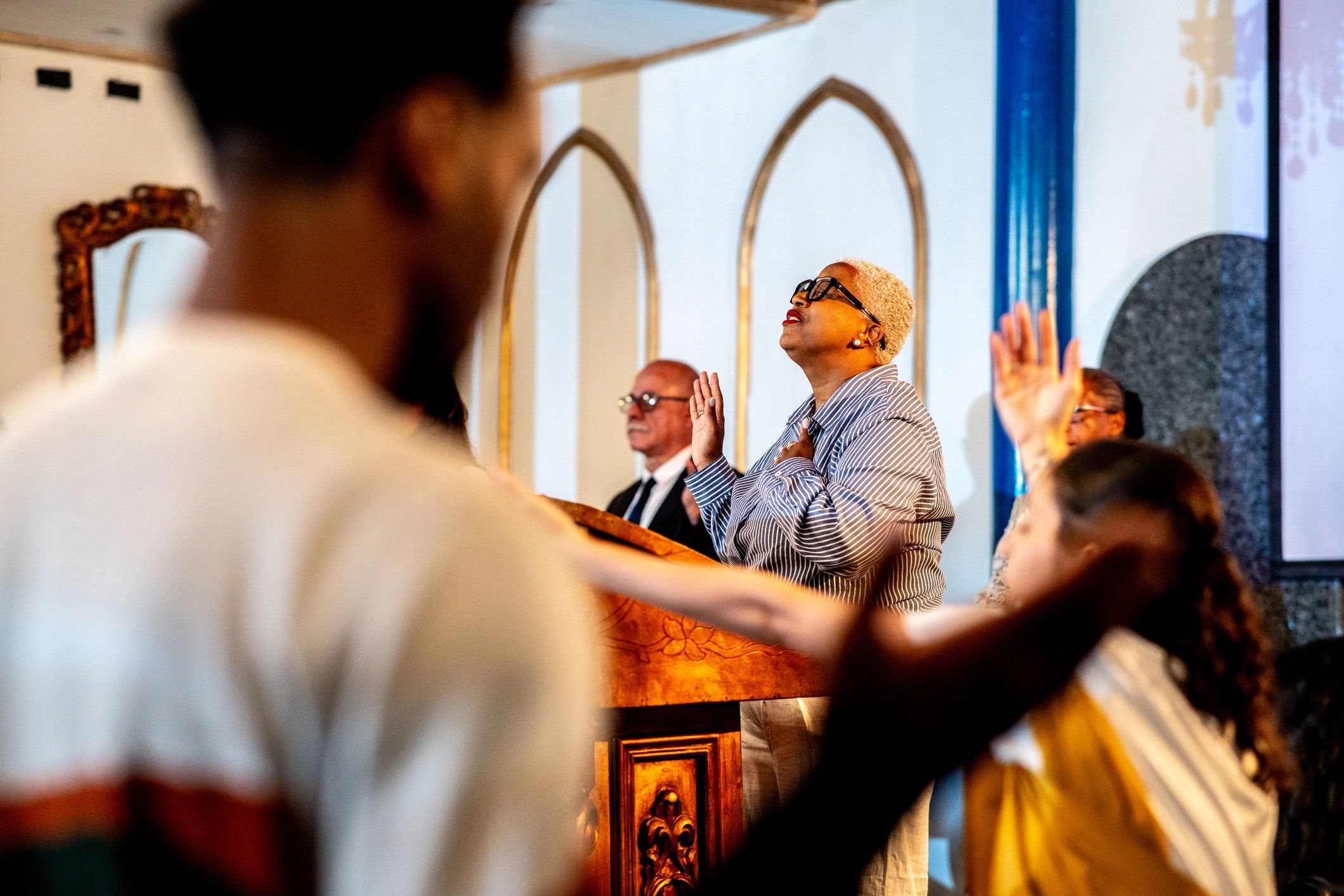 Woman worshiping in church